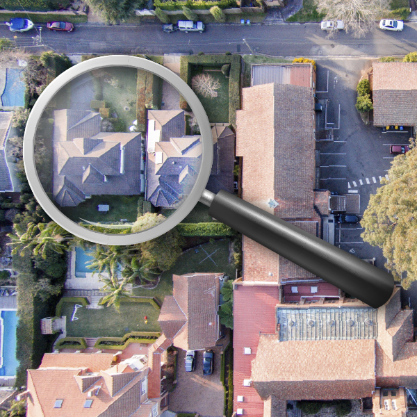 Homes and roofs with a magnifying glass