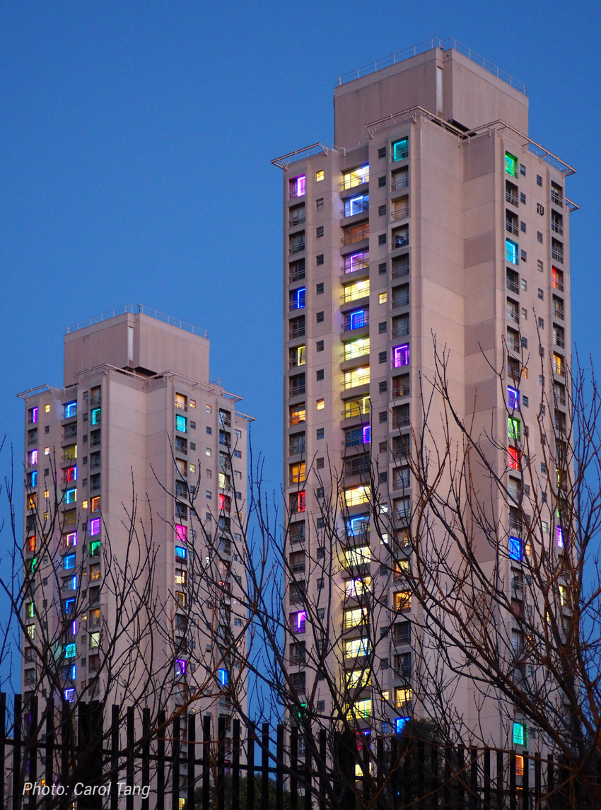 The Redfern Waterloo Towers lit up with coloured lights
