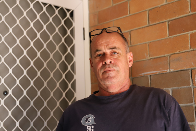 David in front of the repaired door