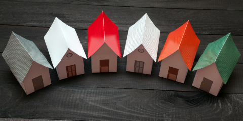 Small paper houses in a semi-circle.